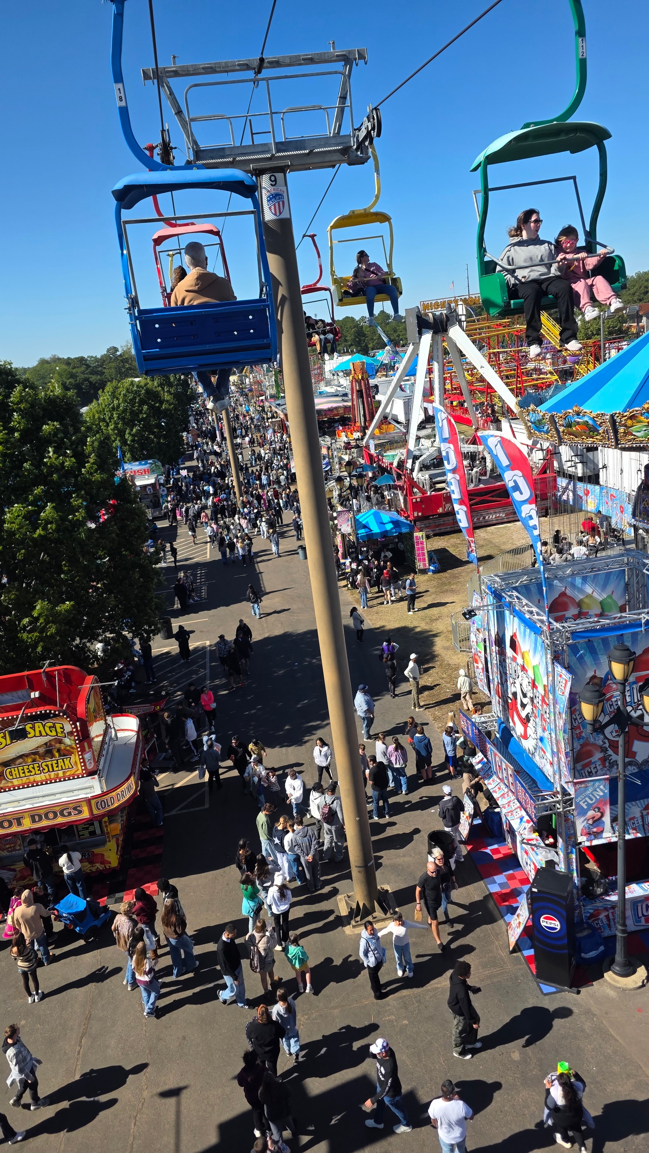NC State Fair 2026 — crowded midway with rides and food vendors